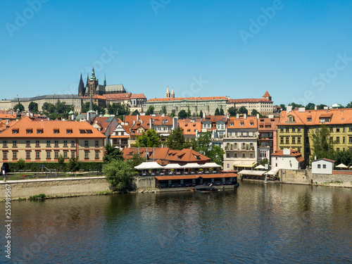 Scenic view on Vltava river and historical center of Prague, buildings and landmarks of old town at sunset, Prague, Czech Republic. August, 2018