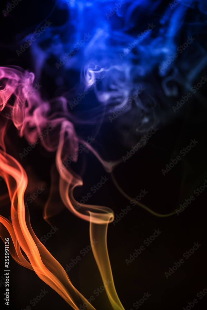 Abstract backgrounds and wallpapers. Colorful smoke on black background.