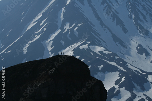 Hikers in front of Koryakskaya Volcano photo