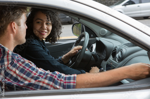 Ethnic couple with a car in the city