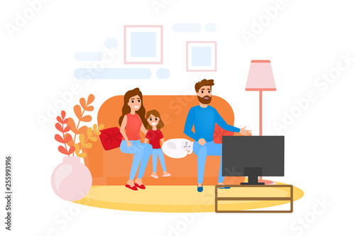Family sitting at home on couch together