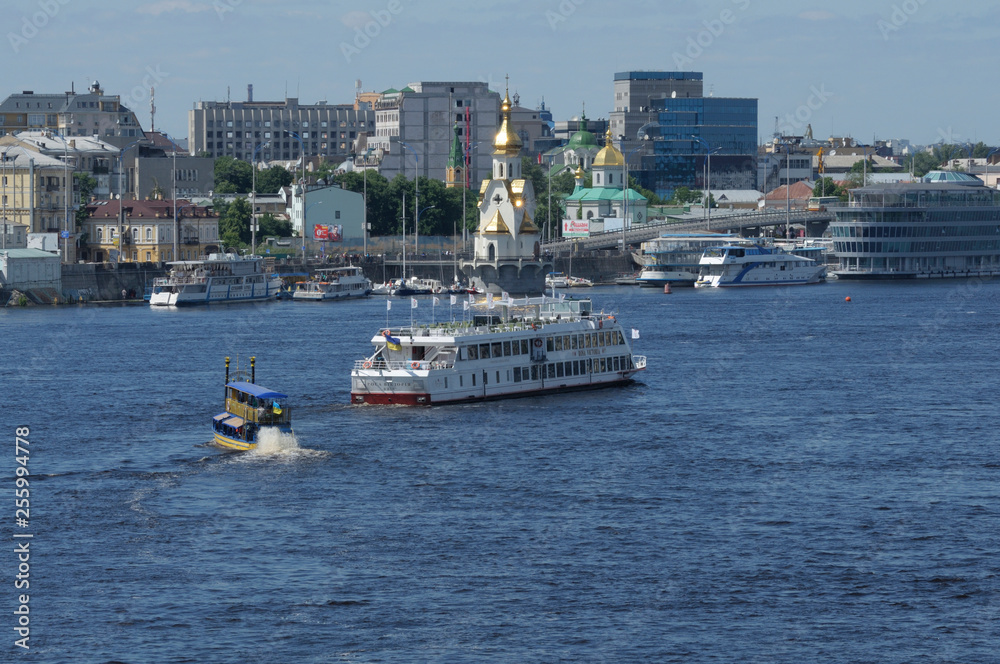 View of Dnieper river and pleasure boats floating on water. 