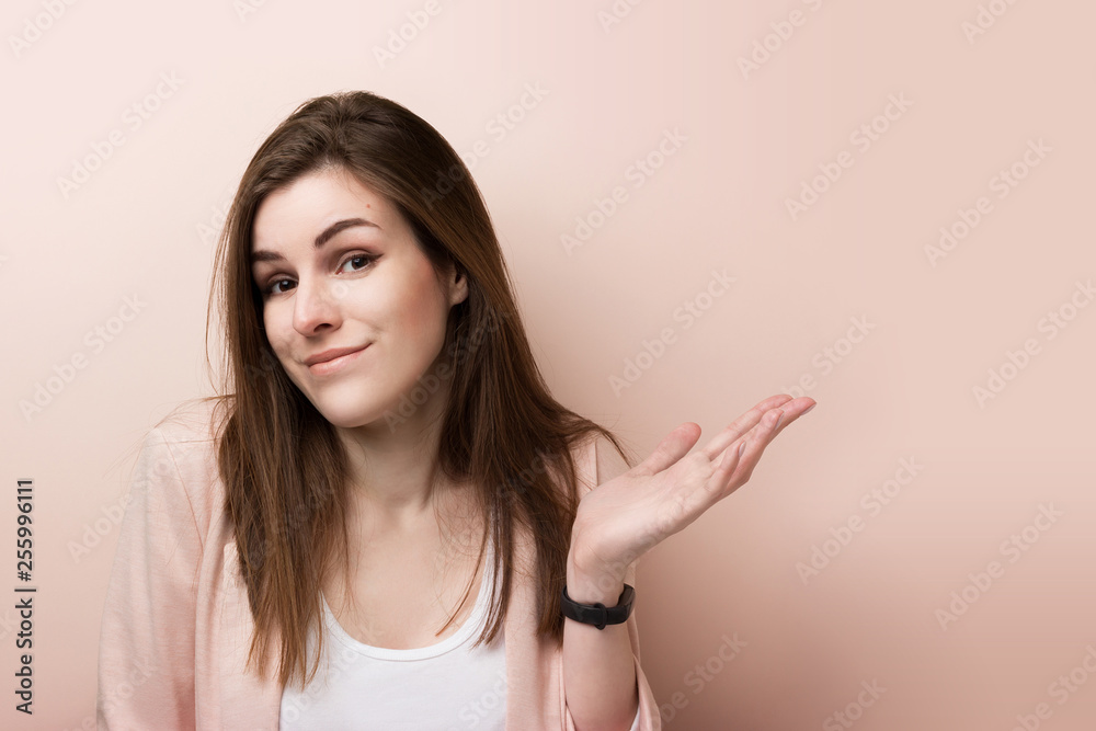 Fototapeta premium Young pretty business woman standing isolated on pink background