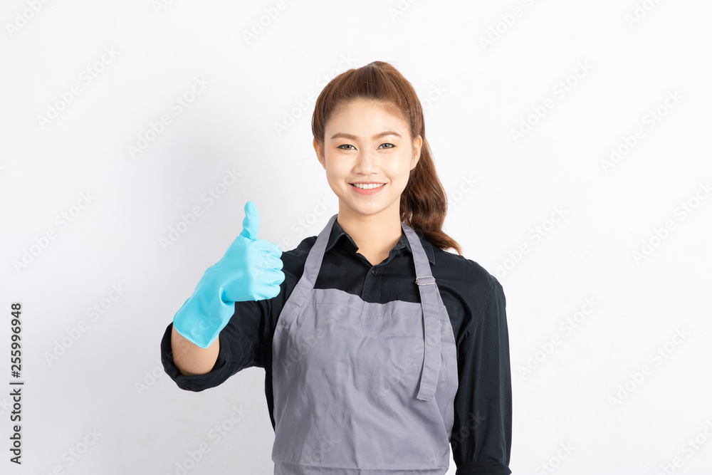 Beautiful Attractive Asian Maid smile and showing thumbs up good hand sign feeling happiness and confident,Isolated on white background,Cleaning Concept Beautiful Attractive Asian Maid smile and showing thumbs up good hand sign feeling happiness and confident,Isolated on white background,Cleaning Concept