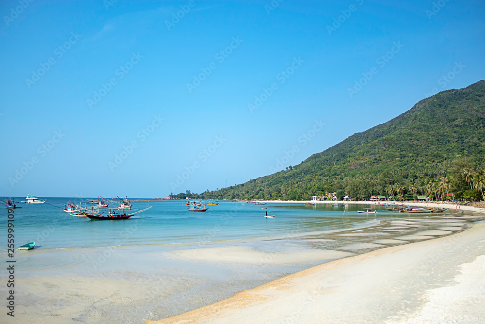 Fishing boats parked on the Beach at Koh Phangan, Surat Thani in Thailand