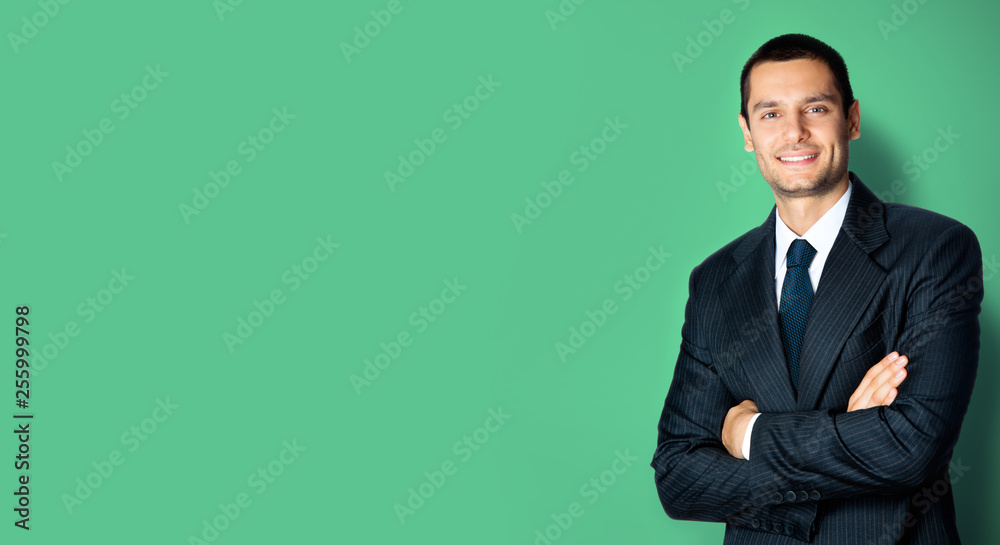 Happy businessman with crossed arms, on green Happy businessman with crossed arms, on green