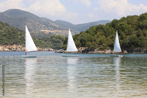 Small sail boats at Bella Vraka beach. Syvota, Greece.