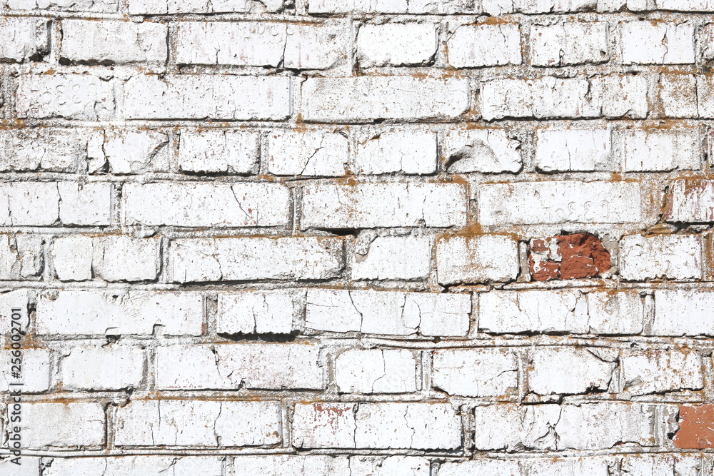 Old wall made of red brick, painted white in loft style for modern designer interior of room, bar or restaurant Old wall made of red brick, painted white in loft style for modern designer interior of room, bar or restaurant