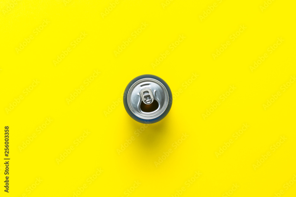 Open can with a drink or empty on a yellow background. minimalism. Concept of day and night, caffeine, energy drink, holiday. Flat lay, top view. Open can with a drink or empty on a yellow background. minimalism. Concept of day and night, caffeine, energy drink, holiday. Flat lay, top view.