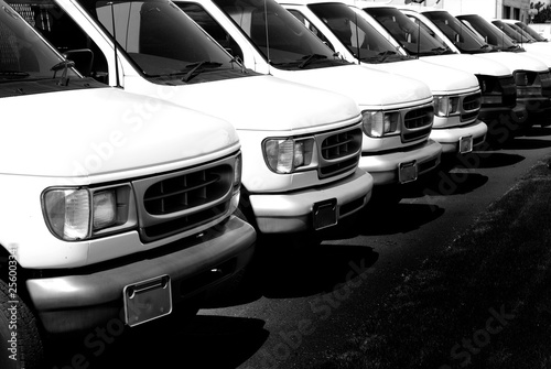 Row of White Vans Deliver Cargo Truck Transportation and Delivery