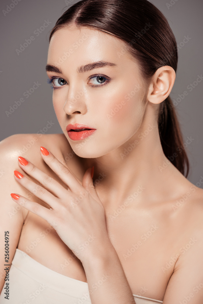 beautiful stylish girl looking at camera and posing isolated on grey beautiful stylish girl looking at camera and posing isolated on grey