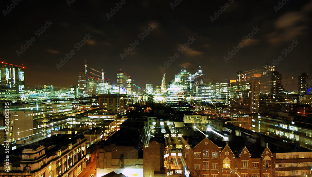 Partial view of London skyline at night using long shutterspeed and zoom