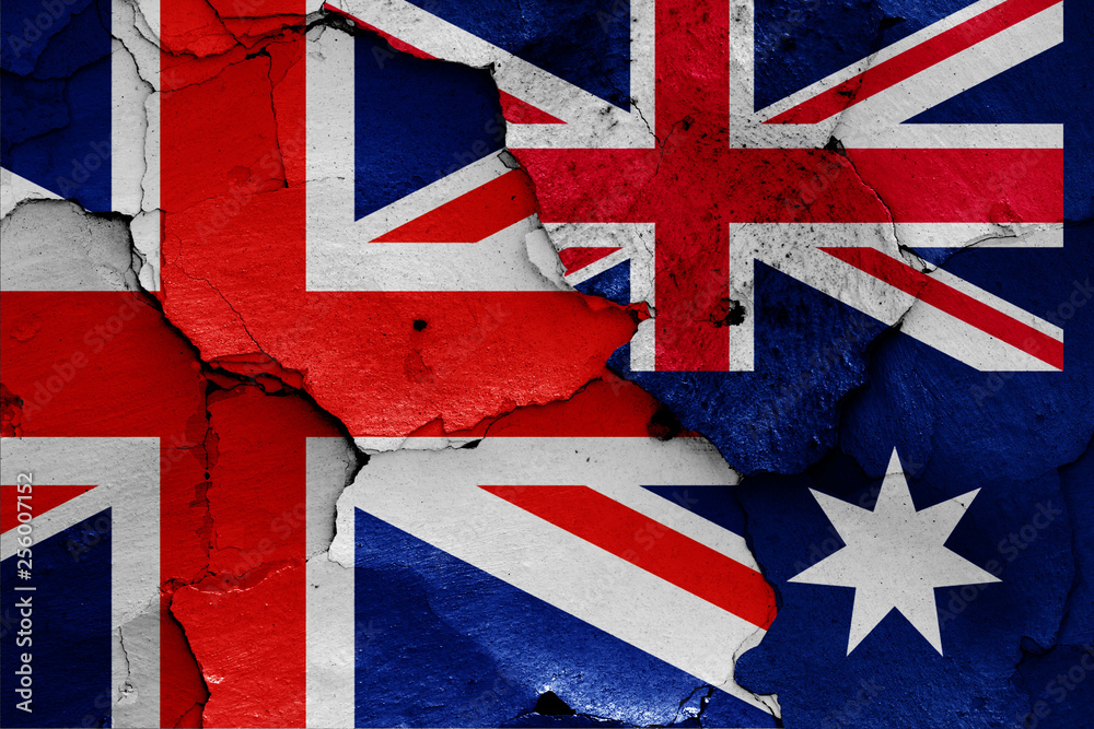 Fototapeta premium flags of UK and Australia painted on cracked wall