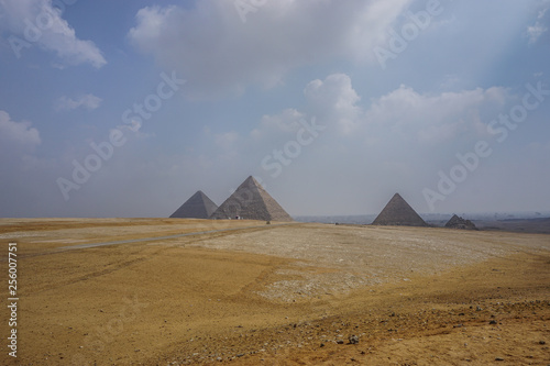 Giza, Egypt: View of the Khufu pyramid complex on a misty morning.