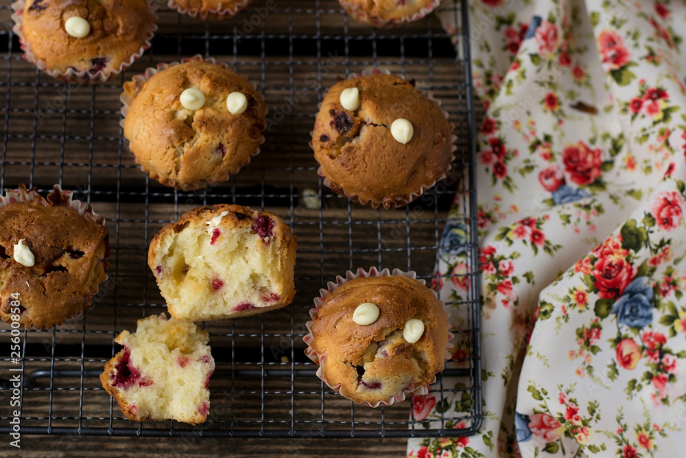 Sweet muffins with raspberries, cranberries and white chocolate chips