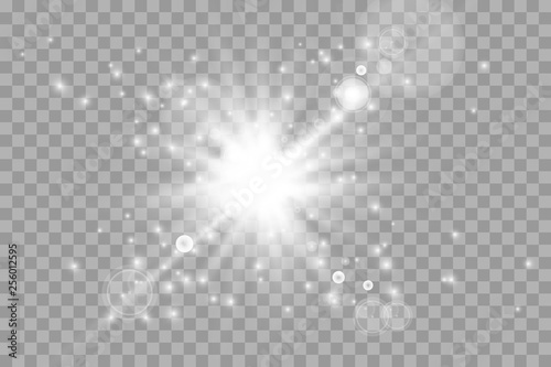White glowing light explodes on a transparent background. Sparkling magical dust particles. Bright Star. Transparent shining sun  bright flash. Vector sparkles. To center a bright flash.