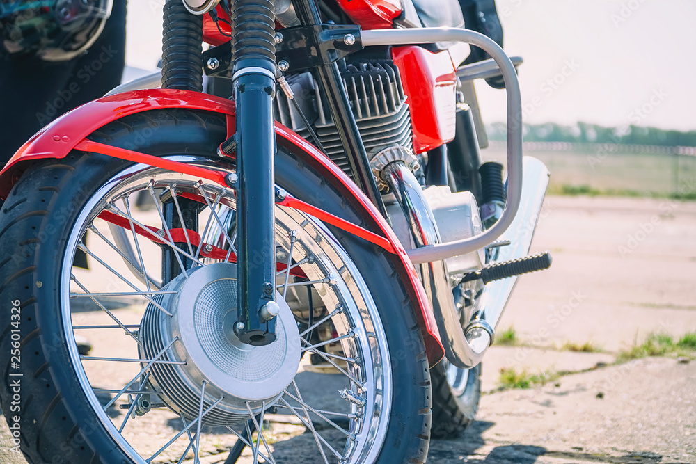 Fototapeta premium The front wheel of the motorcycle. Front view. Selective focus