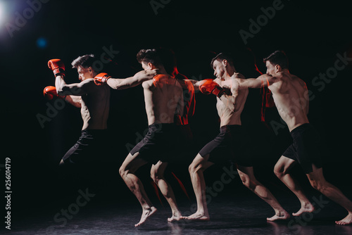 Multiple exposure of strong shirtless muscular boxer in boxing gloves doing punch © LIGHTFIELD STUDIOS