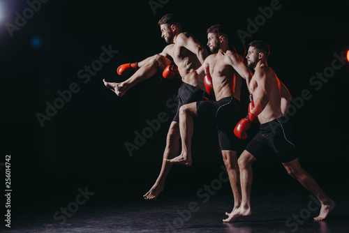 multiple exposure of strong shirtless muscular mma fighter in boxing gloves doing kick in jump