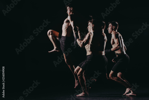 multiple exposure of strong barefoot muscular mma fighter jumping high