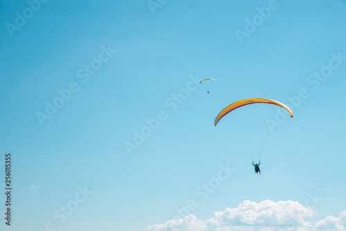 mountains leisure activities. paragliding. summer time