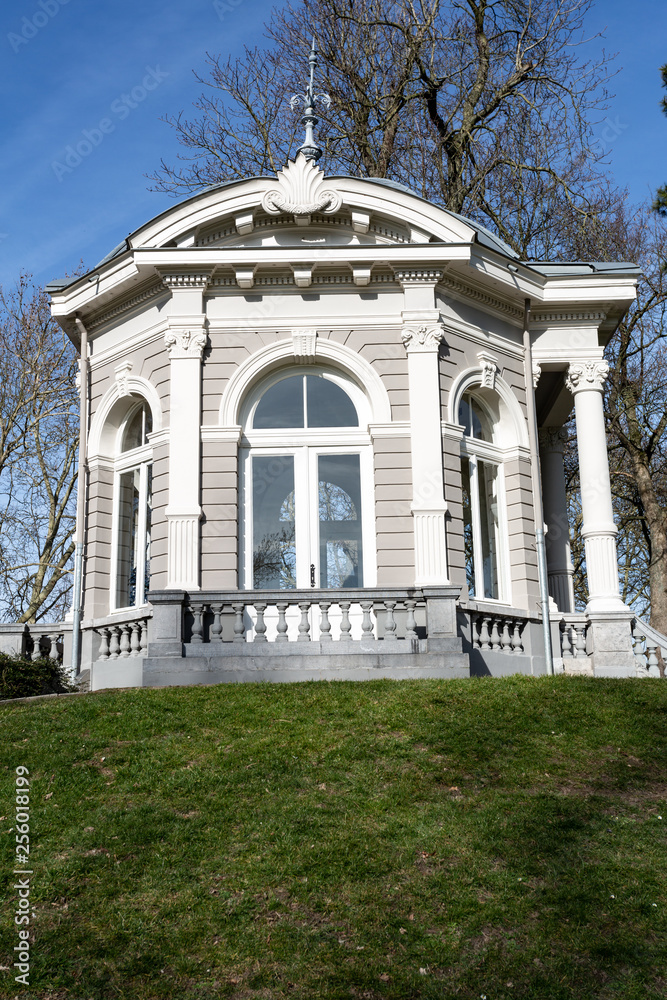 The Tea dome or Gloriette with its arched windows with pillars and a stone railing on a hill in Proosdij park, wonderful sunny winter day in Meerssen south Limburg in the Netherlands Holland