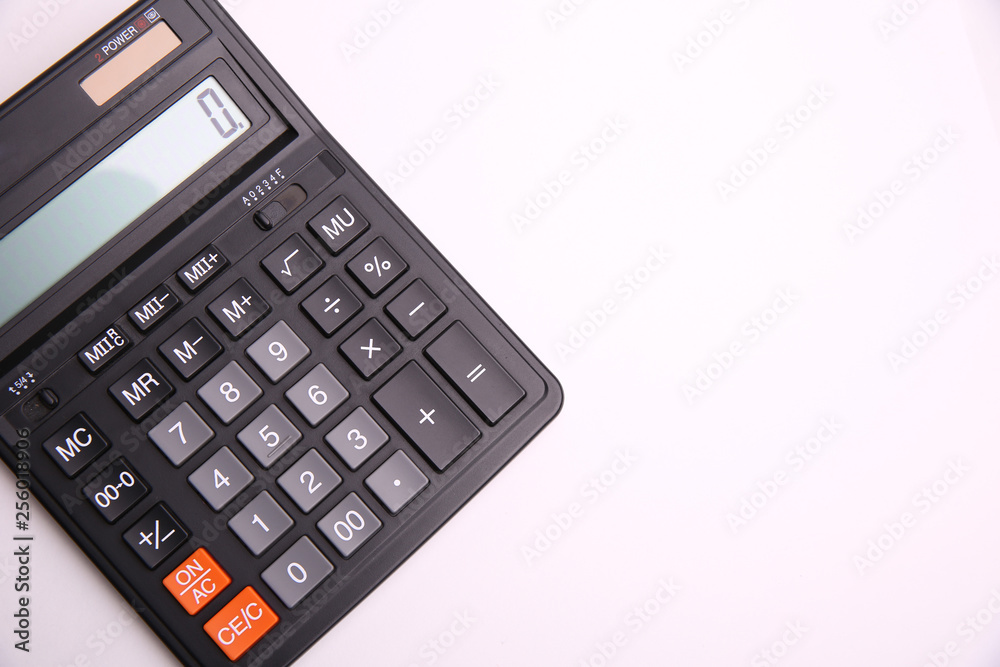black calculator on the side on white background black calculator on the side on white background