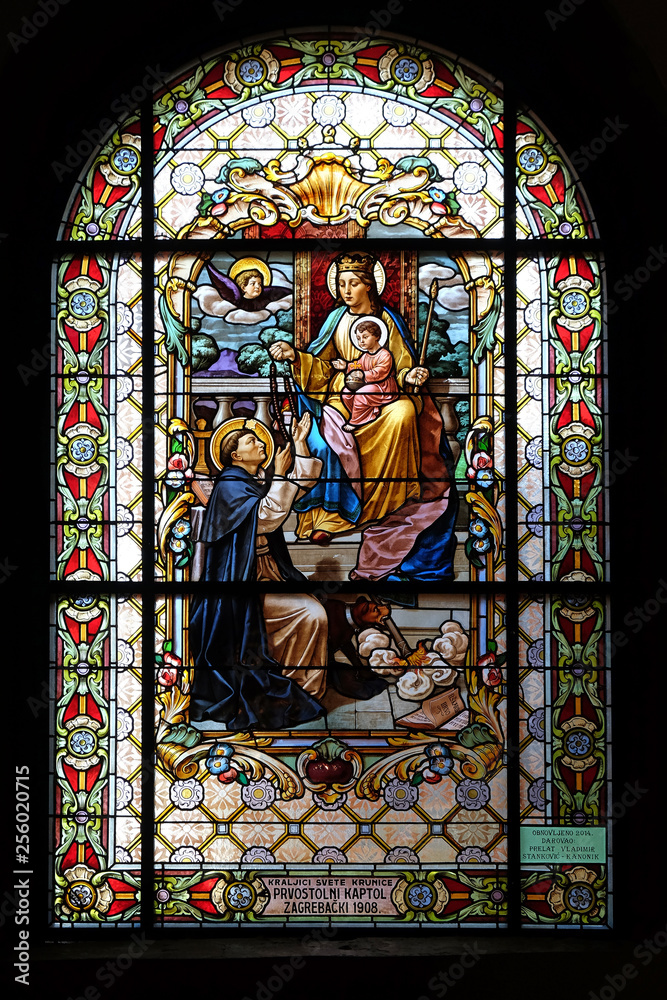 Virgin Mary with baby Jesus and Saint Dominic, stained glass window in the Parish Church of the Visitation of the Virgin Mary in Zagreb, Croatia