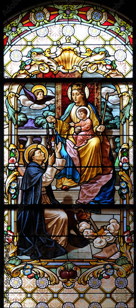 Virgin Mary with baby Jesus and Saint Dominic, stained glass window in the Parish Church of the Visitation of the Virgin Mary in Zagreb, Croatia