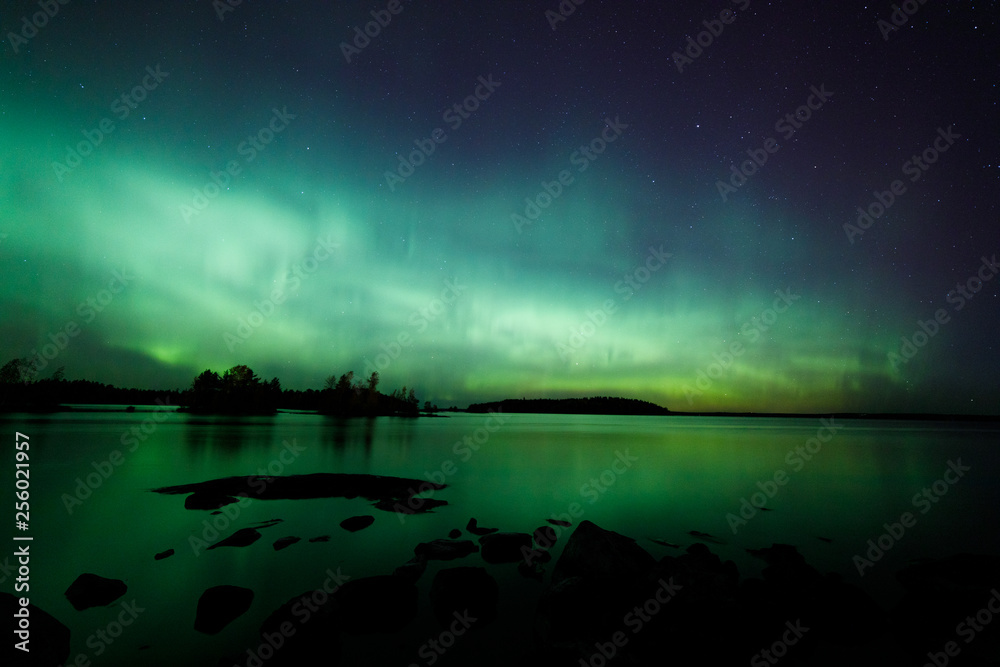 Beautiful northern lights over lake Beautiful northern lights over lake
