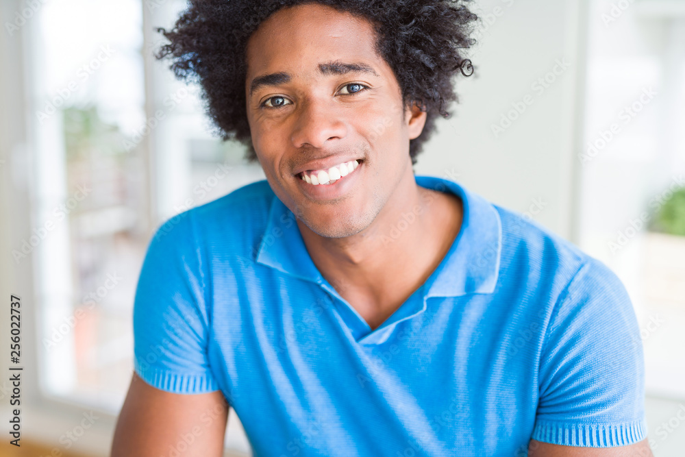 Handsome african american happy man smiling confident Handsome african american happy man smiling confident