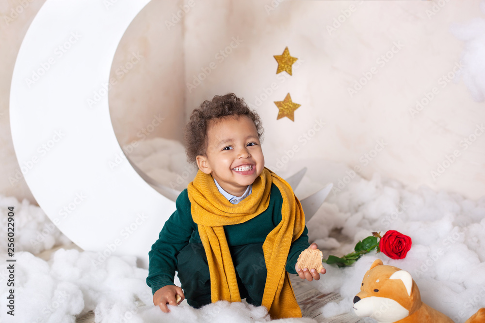 Happy easter Black boy in a green sweater and a yellow scarf