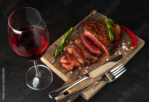 Grilled beef steak with red wine, herbs and spices. View from above