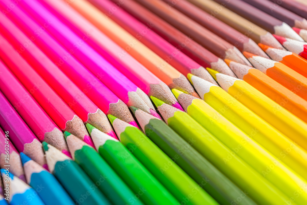 Many multicolored pencils on a wooden background. Different colored pencils with space for text. Copyspace. Back to school. Many multicolored pencils on a wooden background. Different colored pencils with space for text. Copyspace. Back to school.