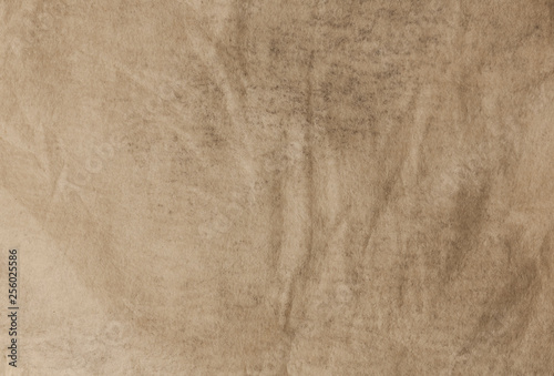 Brown textured flat paper with natural geometric shape.