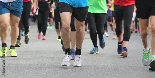 Legs of runners at marathon race