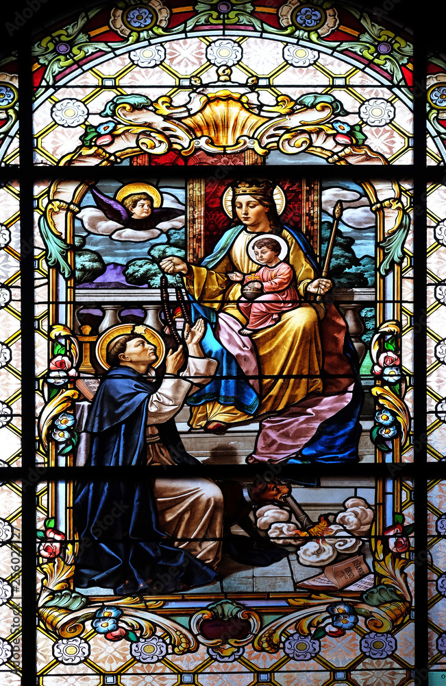 Virgin Mary with baby Jesus and Saint Dominic, stained glass window in the Parish Church of the Visitation of the Virgin Mary in Zagreb, Croatia
