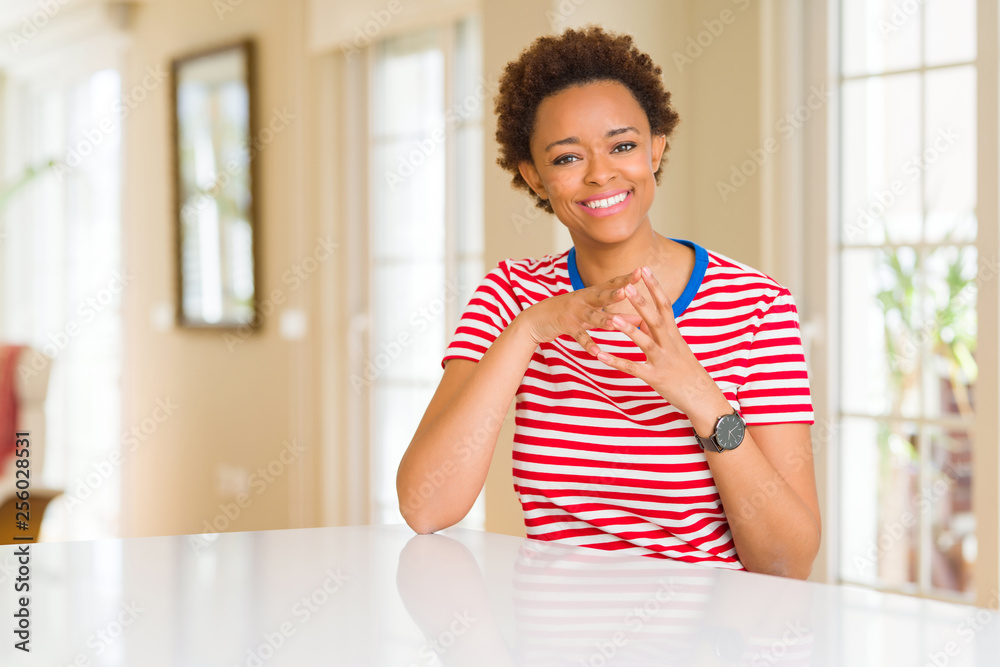 Young beautiful african american woman at home Hands together and fingers crossed smiling relaxed and cheerful. Success and optimistic Young beautiful african american woman at home Hands together and fingers crossed smiling relaxed and cheerful. Success and optimistic