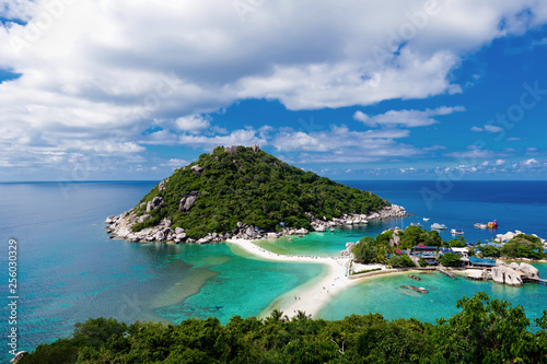 Panoramic aerial view of tropical island in Thailand against blue sky with clouds. 