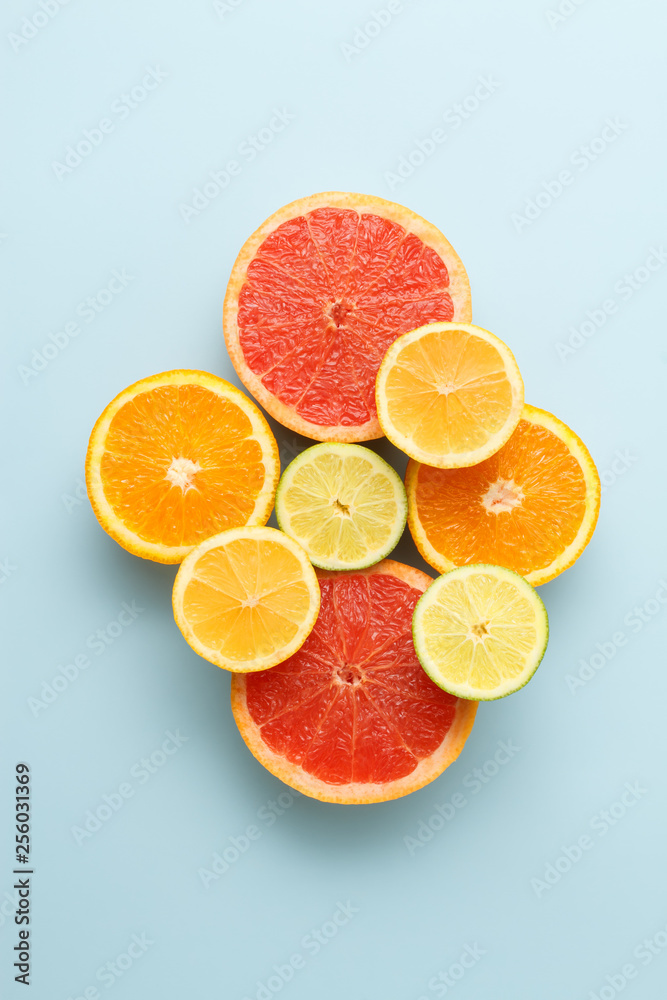Colorful sliced fruits on blue background Colorful sliced fruits on blue background