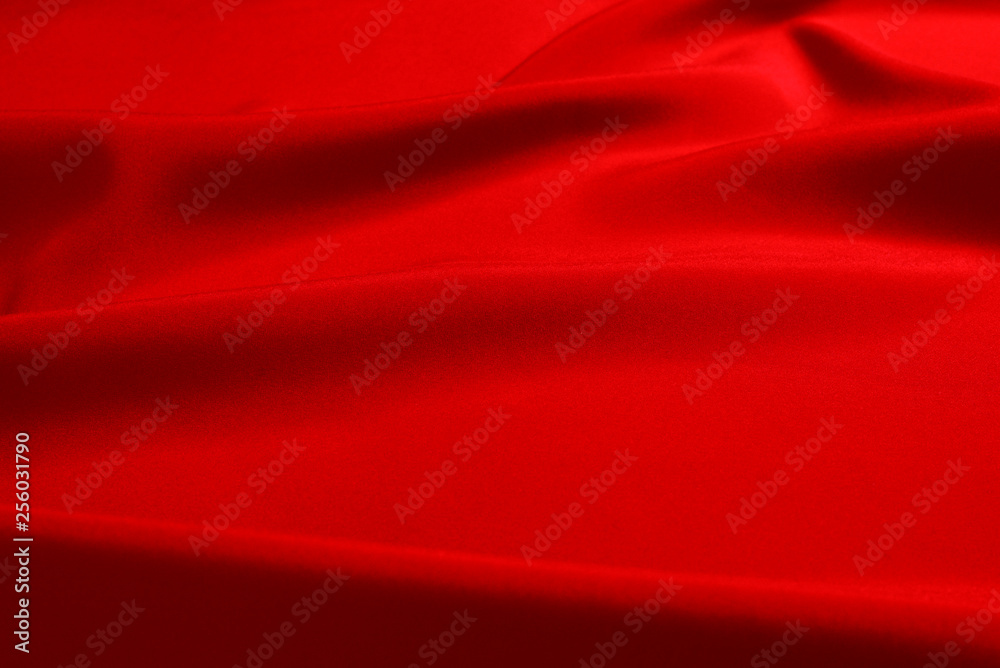 Red silk or satin luxury fabric texture can use as abstract background. Top view. Red silk or satin luxury fabric texture can use as abstract background. Top view.
