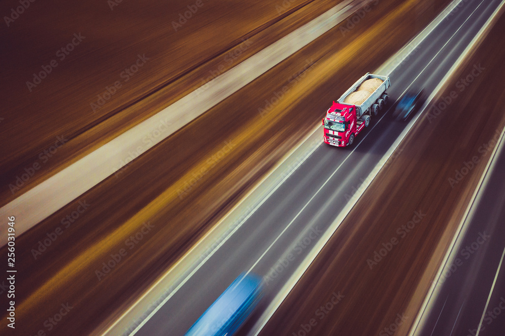Red tipper truck high speed street road highway transportation
