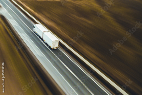 Canvas Print White truck transport goods street road highway