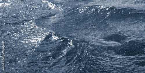 Waves on the surface of the water during the bad weather_