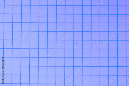 Blank paper sheet of a notebook. Grid. Violet. Background