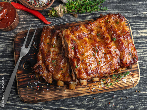 Obraz na plátně grilled pork ribs with sauce on a cutting board , spice, marinade