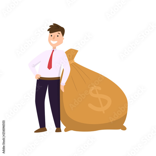 Happy businessman in suit standing near big heavy bag with dollar sign
