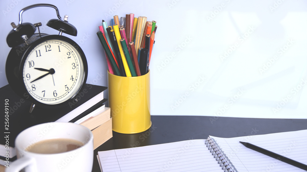 Back to school background with alarm clock, books, glasses, orange and pencils. Back to school background with alarm clock, books, glasses, orange and pencils.