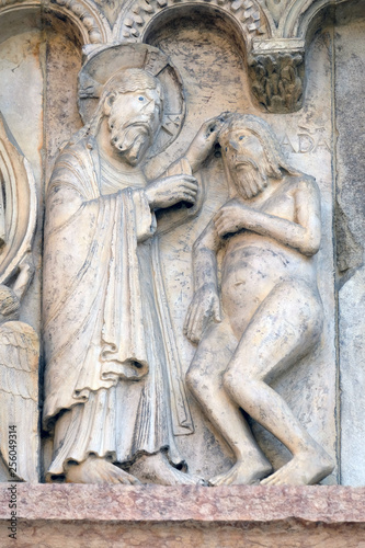 Plate with stories from Genesis: Creation Of Adam relief by Wiligelmo, Modena Cathedral, Italy