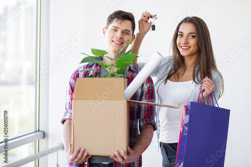 Nnew a apartment. Happy couple in their new home. Young couple hugging indoors photo